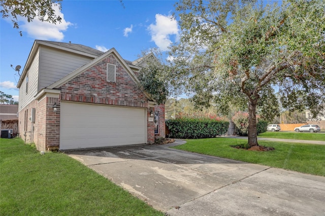 view of front of property with a garage, central air condition unit, and a front yard