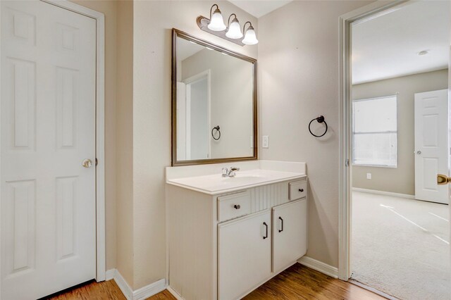 bathroom featuring hardwood / wood-style floors and vanity