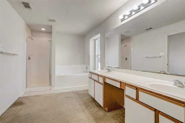 bathroom featuring vanity and shower with separate bathtub