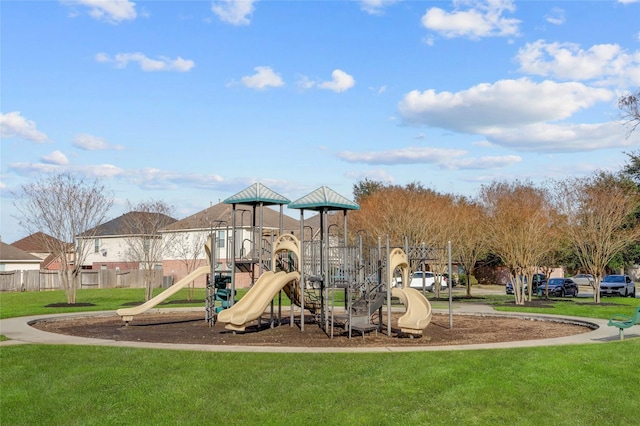 view of jungle gym featuring a lawn