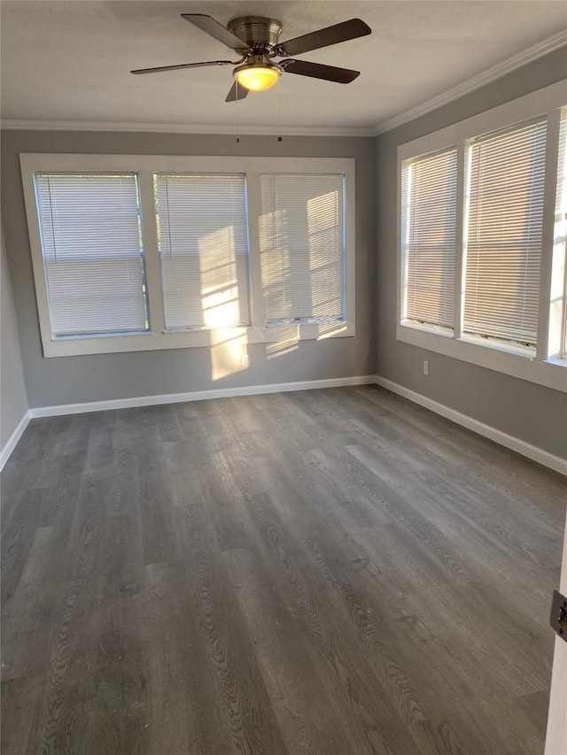 unfurnished room featuring crown molding, ceiling fan, and dark wood-type flooring