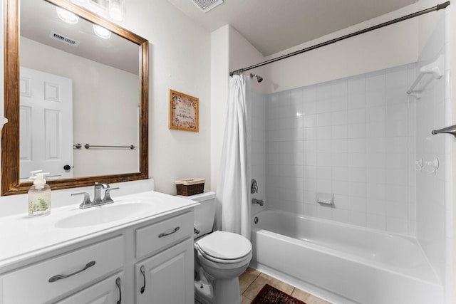 full bathroom featuring tile patterned flooring, vanity, shower / tub combo with curtain, and toilet