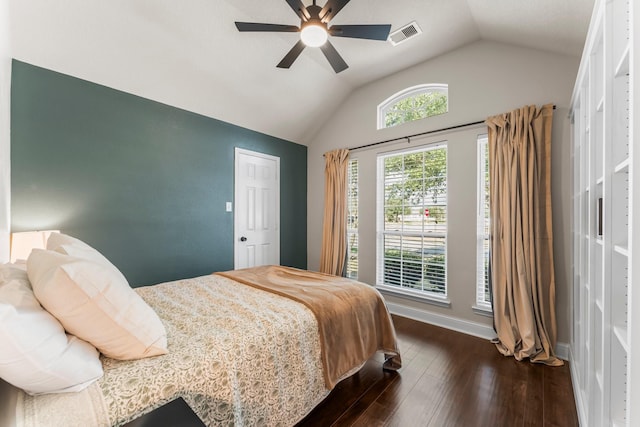 bedroom featuring lofted ceiling, dark wood-type flooring, and ceiling fan