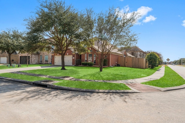 ranch-style house featuring a garage and a front lawn