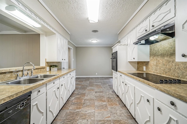 kitchen featuring black appliances, white cabinetry, and sink