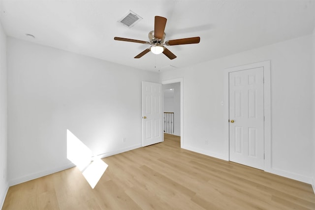 unfurnished bedroom featuring light hardwood / wood-style flooring and ceiling fan