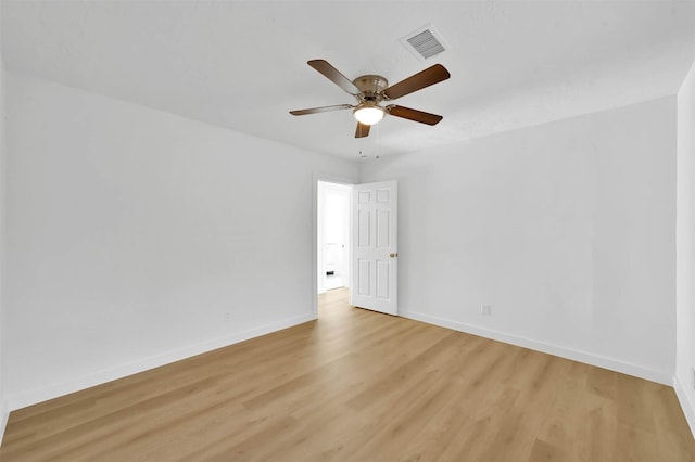 empty room featuring light wood-type flooring and ceiling fan