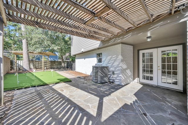 view of patio / terrace with central AC, a pergola, and french doors