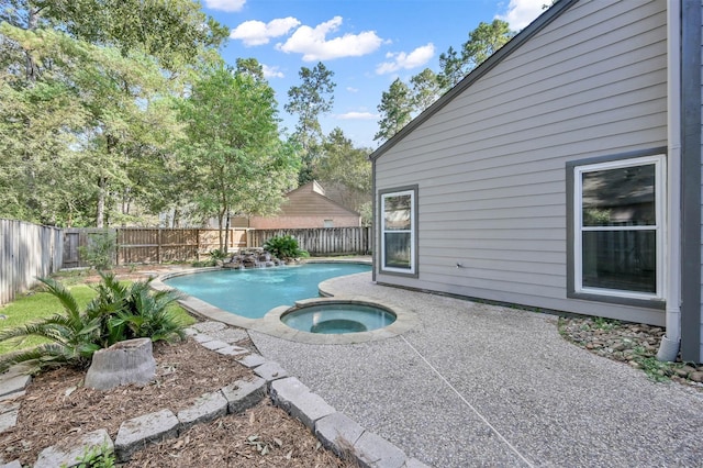 view of pool featuring an in ground hot tub