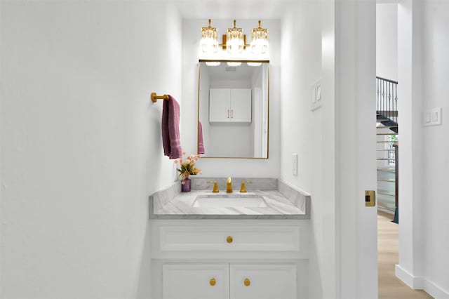 bathroom with wood-type flooring and vanity