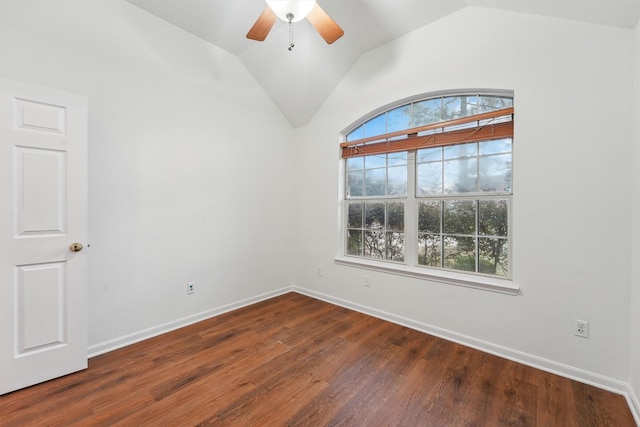 empty room featuring ceiling fan, lofted ceiling, and dark hardwood / wood-style flooring