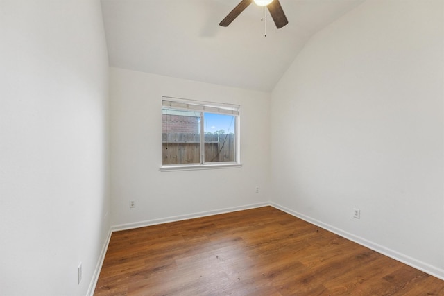 empty room featuring vaulted ceiling, ceiling fan, and wood-type flooring