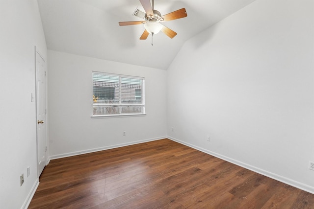 spare room featuring vaulted ceiling, ceiling fan, and dark hardwood / wood-style flooring