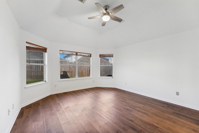 unfurnished room with ceiling fan and dark wood-type flooring