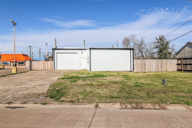 garage featuring a lawn