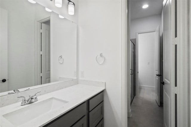 bathroom with tile patterned floors and vanity