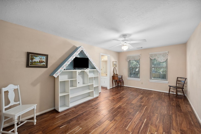 interior space with dark hardwood / wood-style flooring, a textured ceiling, and ceiling fan