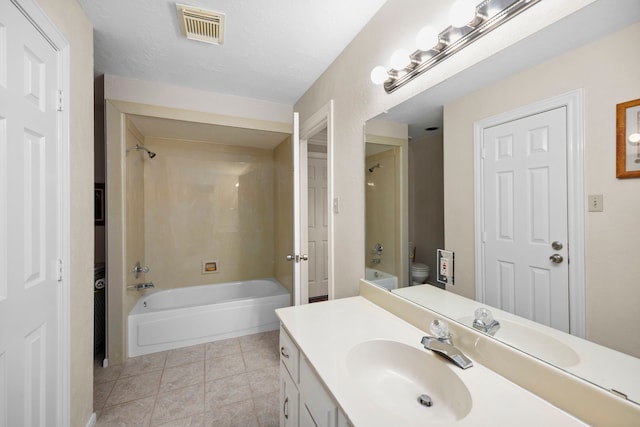 full bathroom with vanity, tile patterned floors, shower / bathtub combination, and toilet