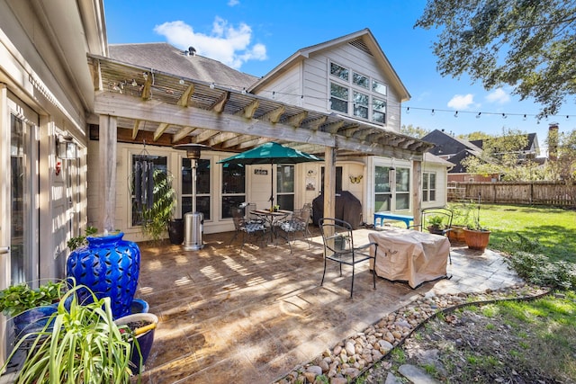 back of property featuring a yard, a pergola, and a wooden deck