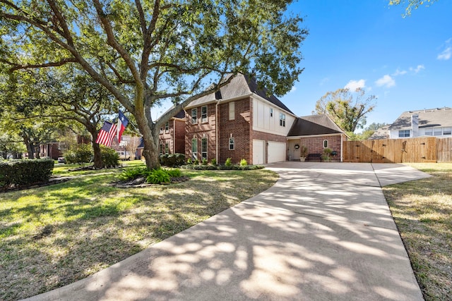 view of front of home featuring a garage and a front yard