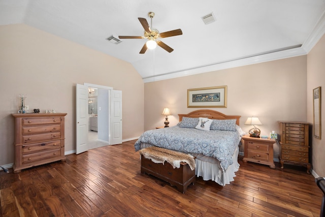 bedroom featuring dark wood-type flooring, ceiling fan, crown molding, and vaulted ceiling