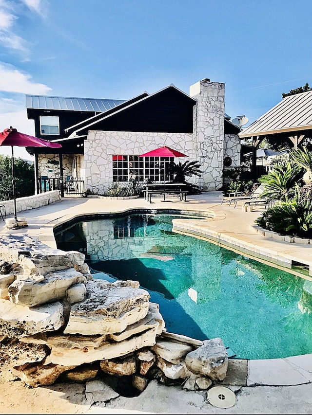 view of pool with a patio area