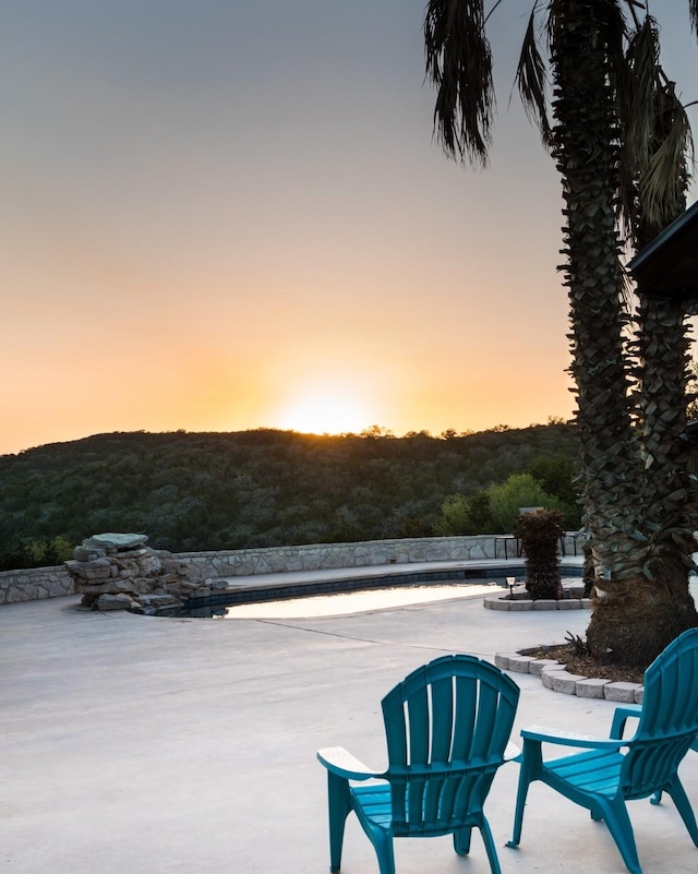 view of patio terrace at dusk