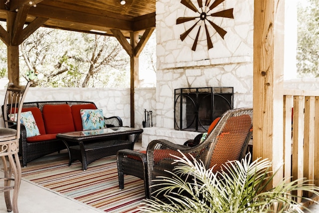 view of patio / terrace featuring an outdoor living space with a fireplace