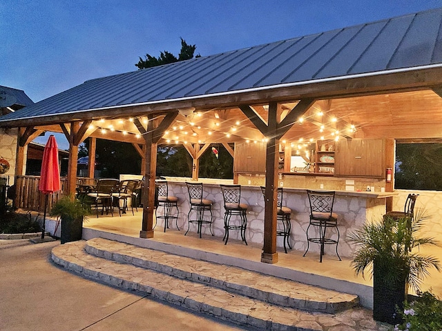 view of patio / terrace featuring an outdoor bar