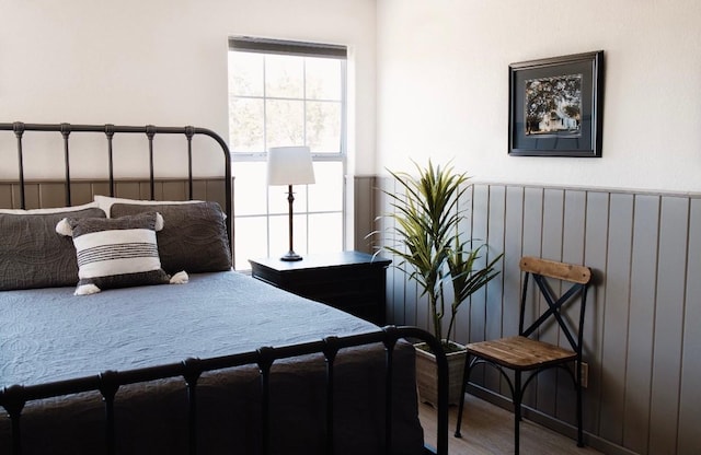 bedroom with hardwood / wood-style flooring