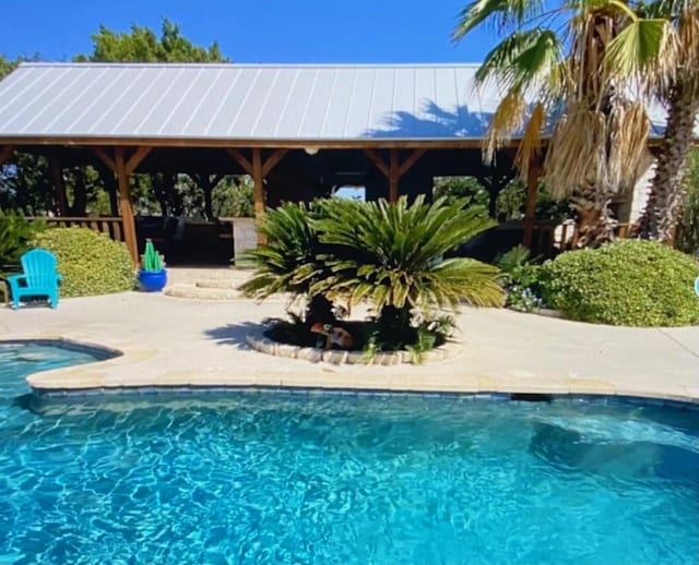 view of swimming pool with a gazebo