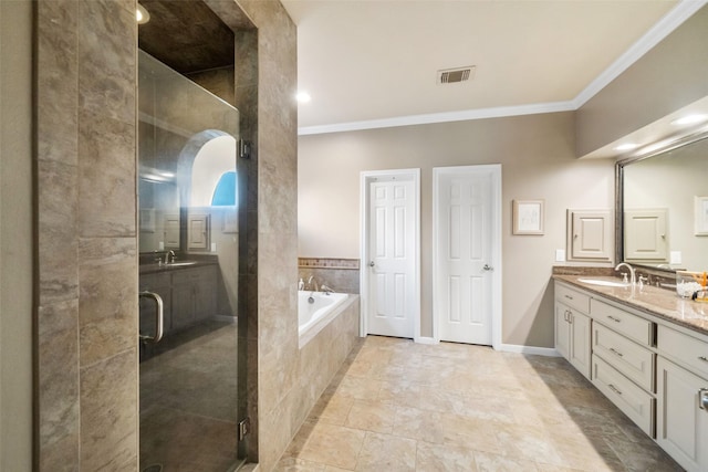 bathroom with vanity, ornamental molding, and separate shower and tub