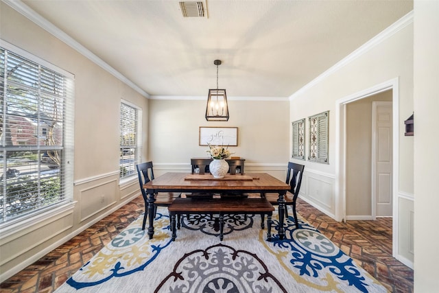 dining area with crown molding