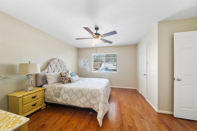 bedroom with ceiling fan and light hardwood / wood-style flooring