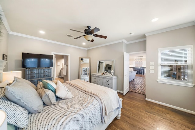 bedroom with crown molding, ceiling fan, connected bathroom, and hardwood / wood-style floors