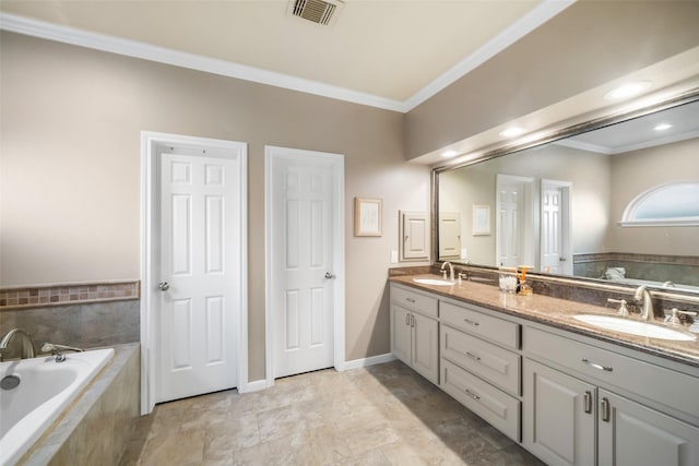 bathroom with crown molding, vanity, and a relaxing tiled tub