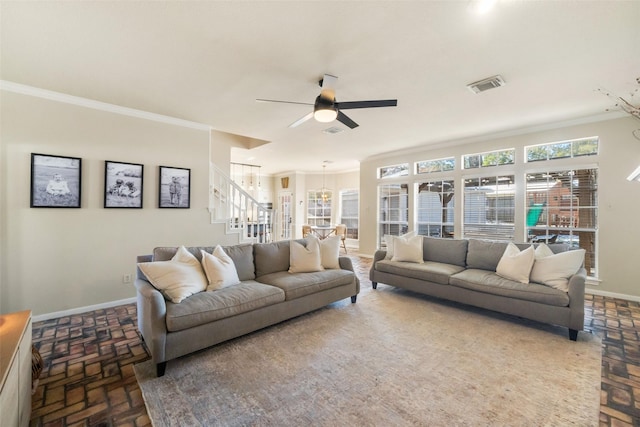 living room featuring ornamental molding and ceiling fan