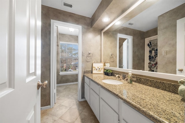 bathroom with vanity and tile patterned flooring