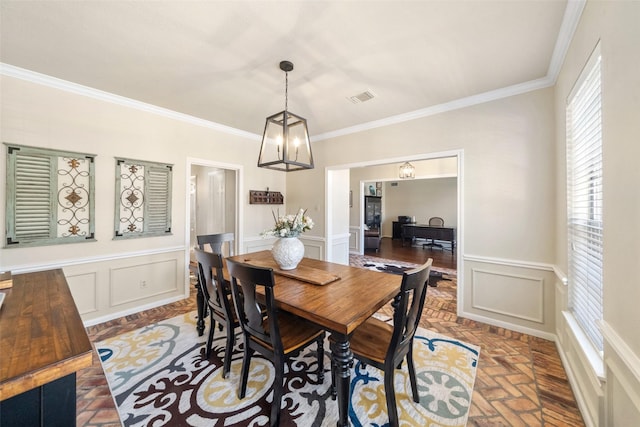 dining room featuring ornamental molding