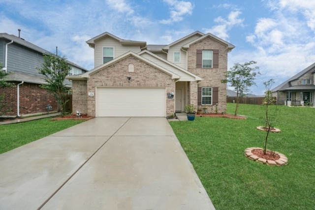 view of front of house with a front yard and a garage