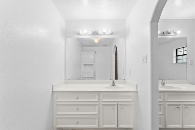 bathroom featuring vanity and a textured ceiling