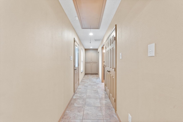 hallway with light tile patterned flooring