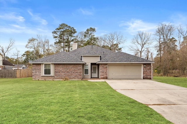 view of front of home featuring a garage and a front yard