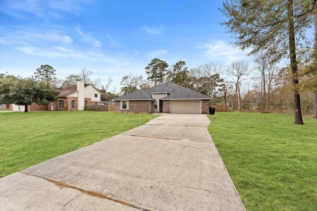 ranch-style house featuring a garage and a front yard