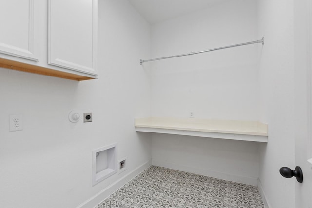 clothes washing area with hookup for an electric dryer and cabinets