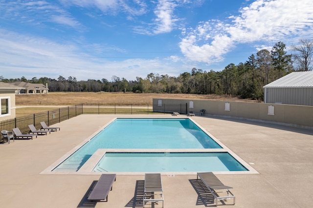 view of swimming pool featuring a patio area