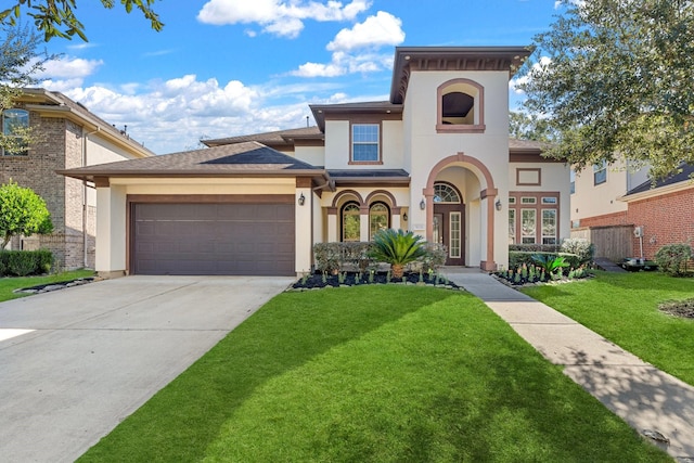 view of front of house with a front yard and a garage