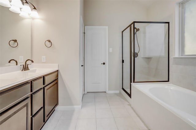 bathroom with tile patterned floors, vanity, an inviting chandelier, and plus walk in shower