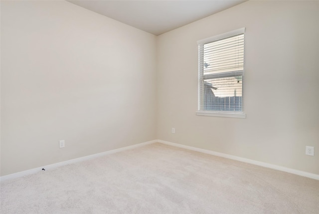 empty room featuring light colored carpet