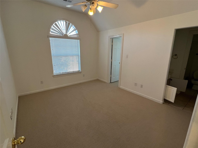 6731 Pinetop Glen Ln, Spring, TX 77379 - unfurnished bedroom featuring lofted ceiling, light colored carpet, baseboards, and a ceiling fan